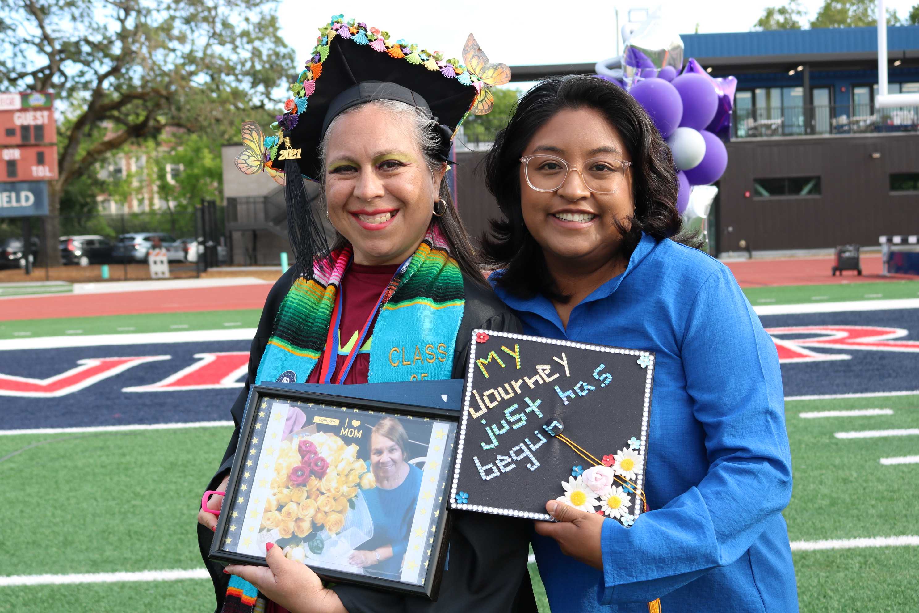 Celebrate CE - Magdalena & a student with her cap and gown